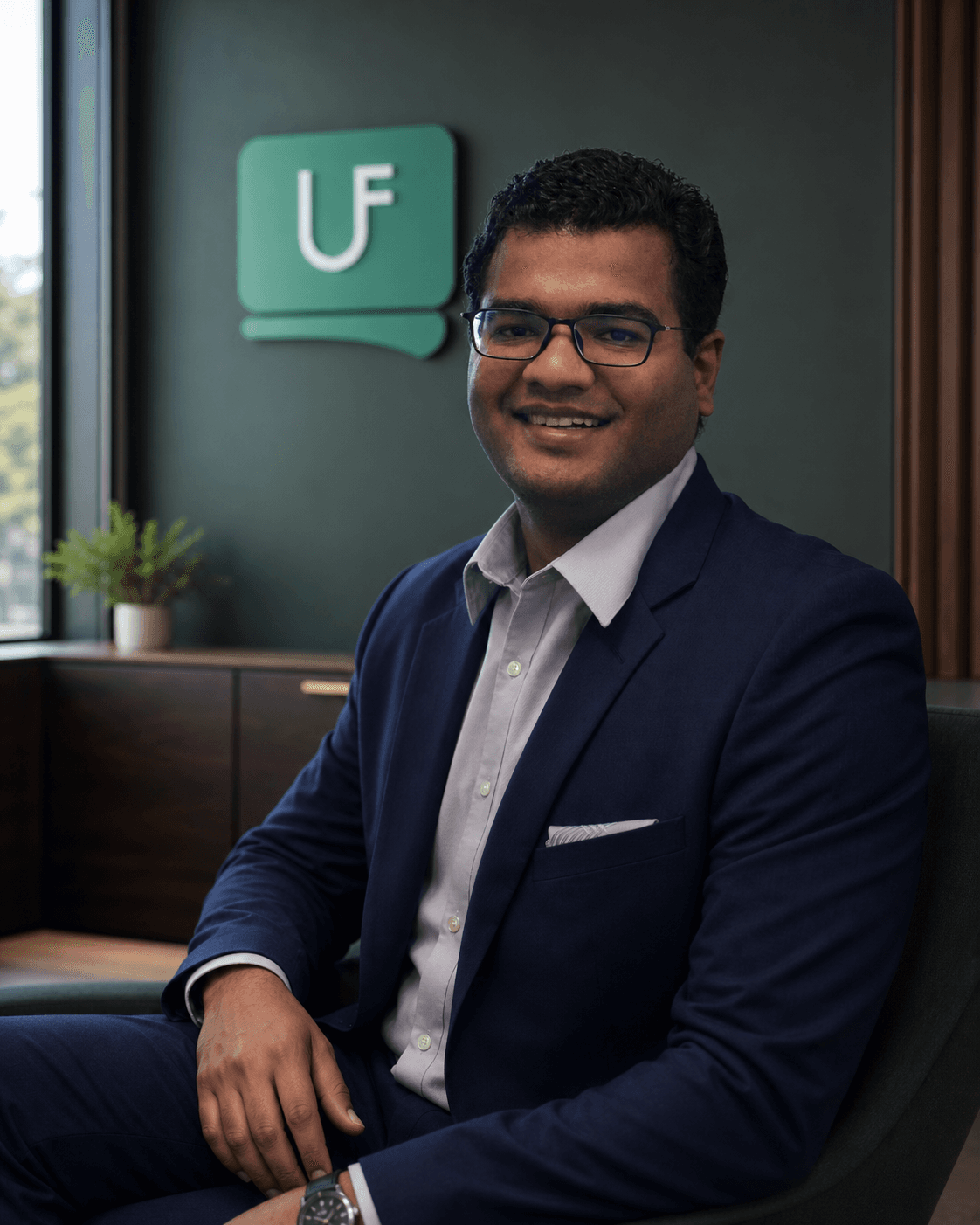 Nilesh Sharma, Managing Partner of UfirstCPA, seated in the UfirstCPA office